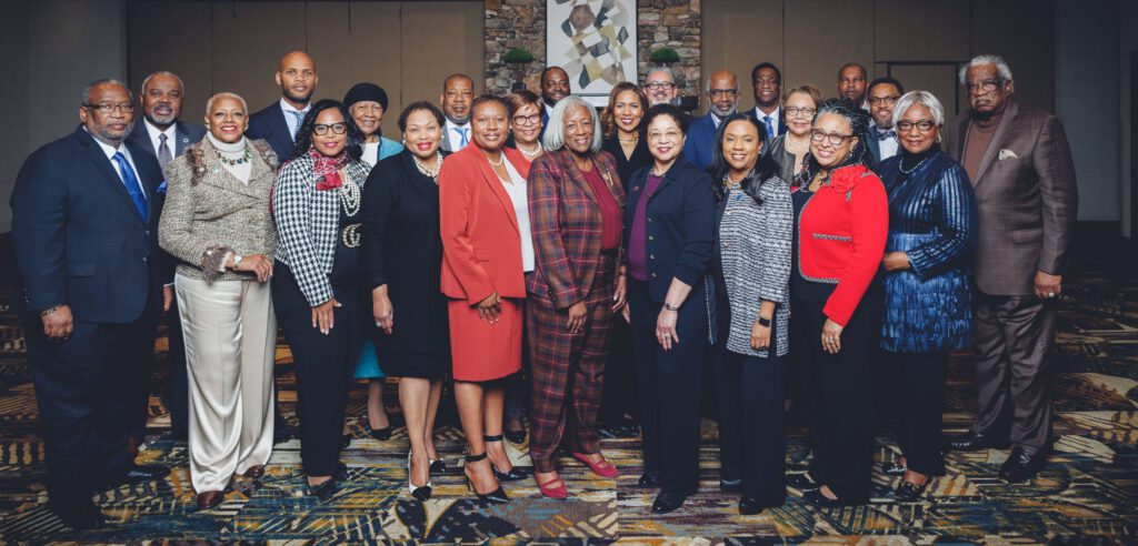 Group photo of HBCU leaders and stakeholders at the UNCF North Carolina Presidents Summit, standing together in formal business attire